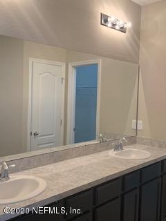 5370 Kellar Circle Jacksonville, FL 32218 - Photo 16 of 21 a bathroom with a sink vanity and a mirror
