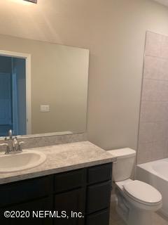 5370 Kellar Circle Jacksonville, FL 32218 - Photo 19 of 21 a bathroom with a sink a toilet and mirror