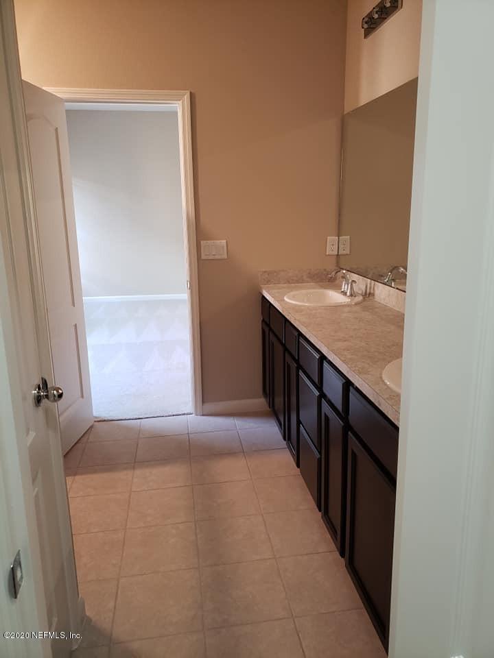 5370 Kellar Circle Jacksonville, FL 32218 - Photo 6 of 21 a bathroom with a granite countertop sink and a mirror