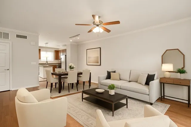 a kitchen with stainless steel appliances granite countertop a sink a stove a microwave and wooden cabinets