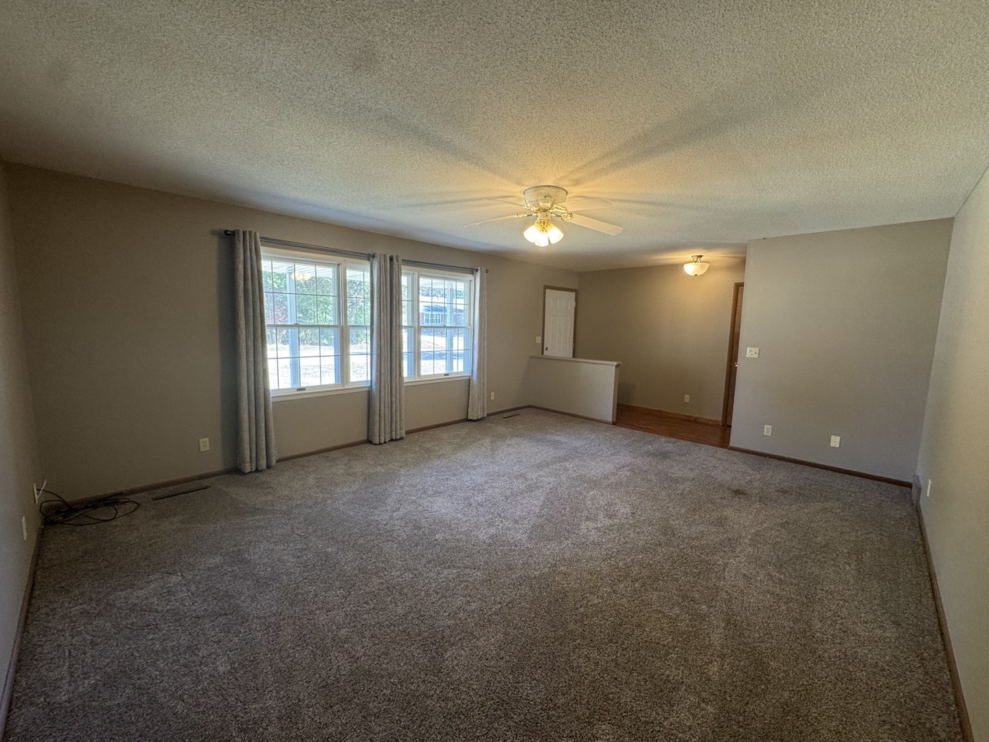 805 Keith Street Morrison, IL 61270 - Photo 18 of 33 an empty room with windows and fireplace
