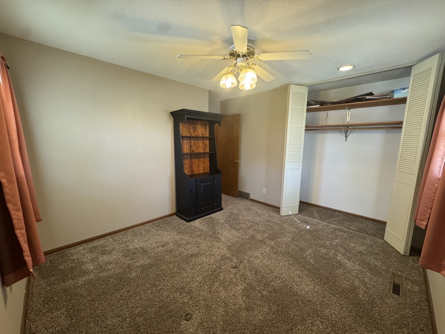 805 Keith Street Morrison, IL 61270 - Photo 21 of 33 an empty room with chandelier fan and kitchen view