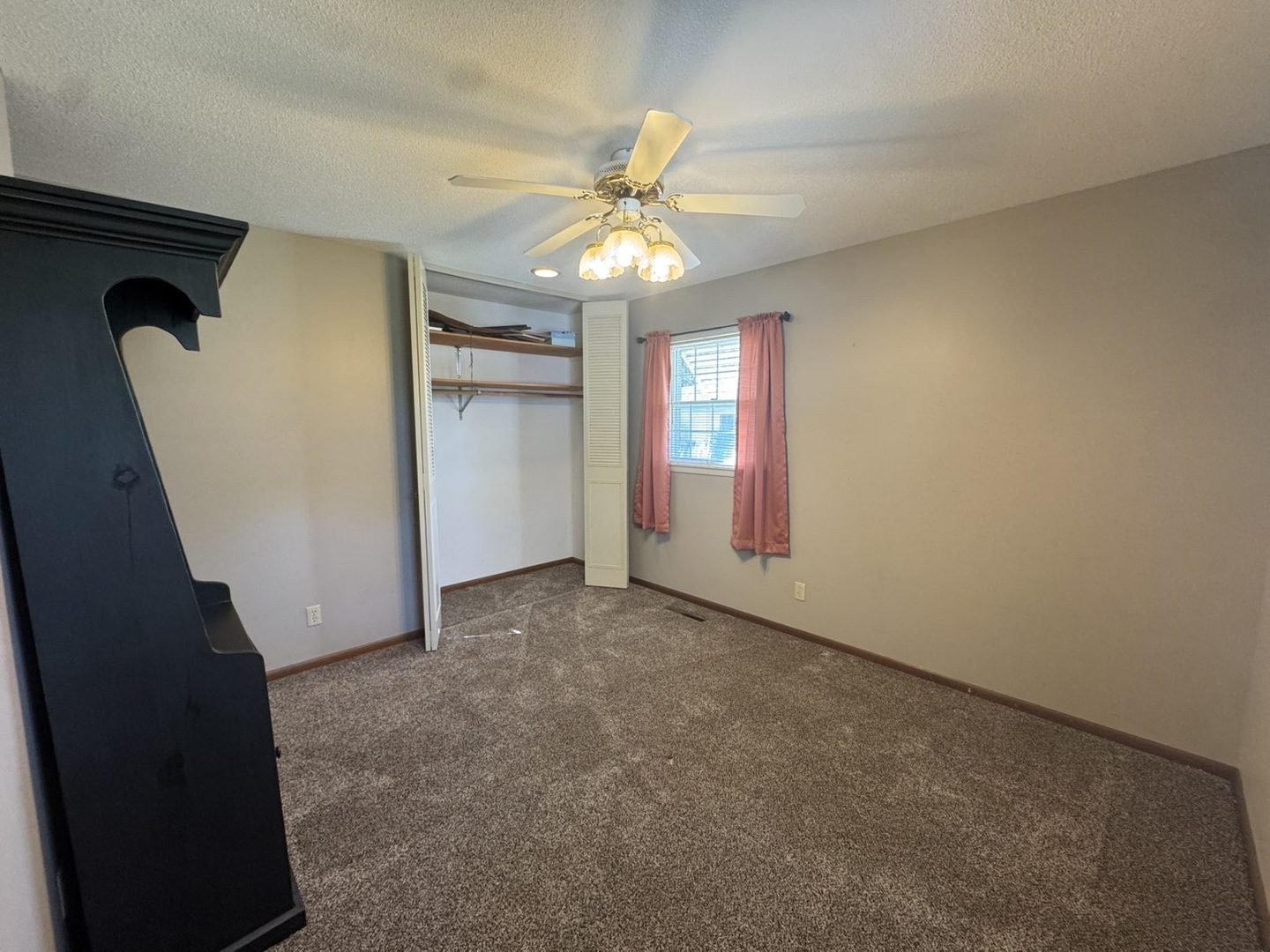 805 Keith Street Morrison, IL 61270 - Photo 22 of 33 an empty room with windows and fan