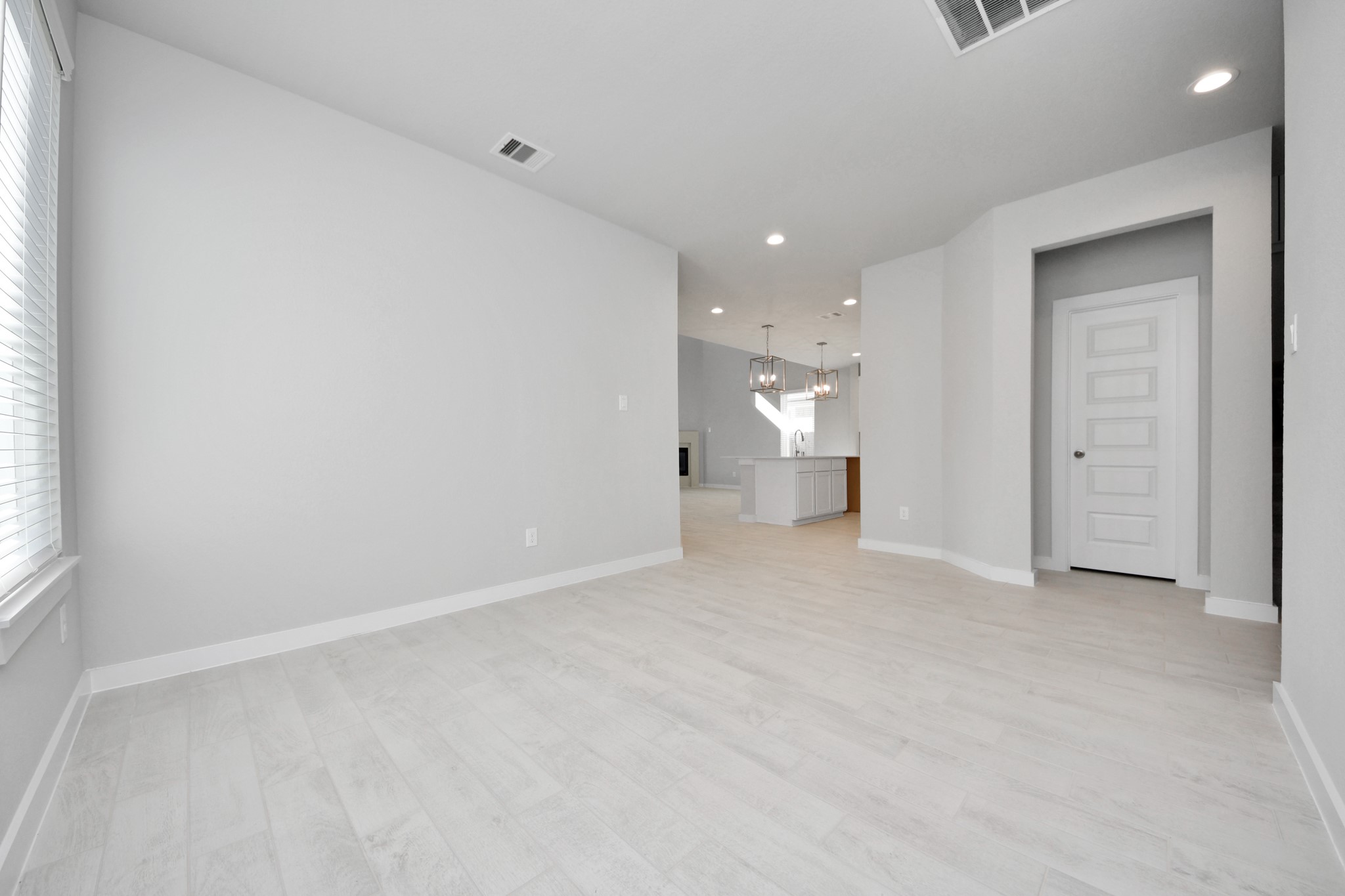 3006 Burris Park Drive Spring, TX 77373 - Photo 11 of 45 Craft enduring memories with loved ones around the table! This roomy dining area boasts stylish flooring, personalized paint, and is conveniently situated next to the family room and kitchen, fostering an open and inclusive ambiance.