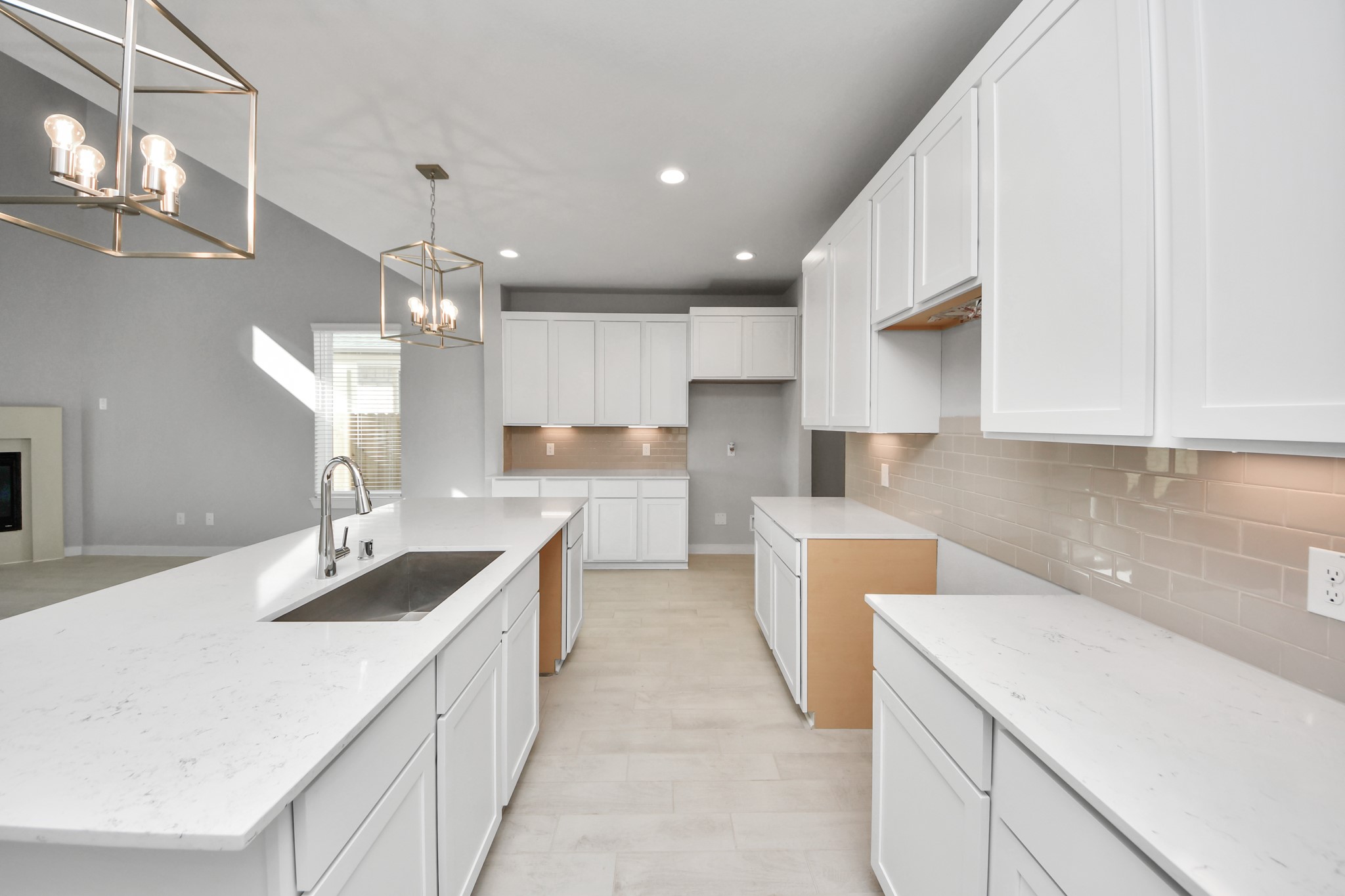 3006 Burris Park Drive Spring, TX 77373 - Photo 19 of 45 The open concept effortlessly connects the kitchen to the expansive family room, forming a perfect hub for gatherings. This seamless flow creates an inviting space where cooking and socializing come together harmoniously.