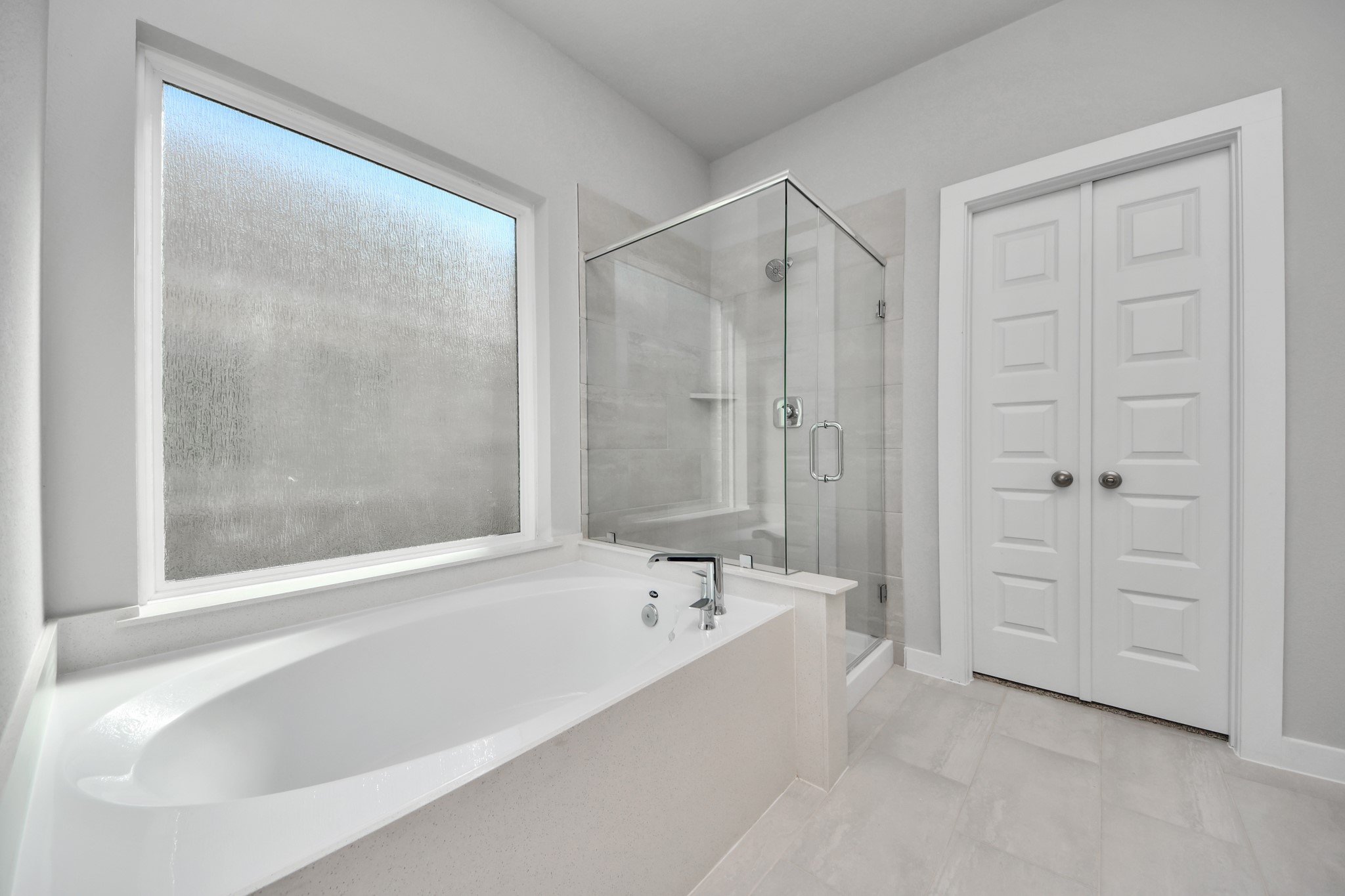 3006 Burris Park Drive Spring, TX 77373 - Photo 27 of 45 a bathroom with a bathtub and a shower