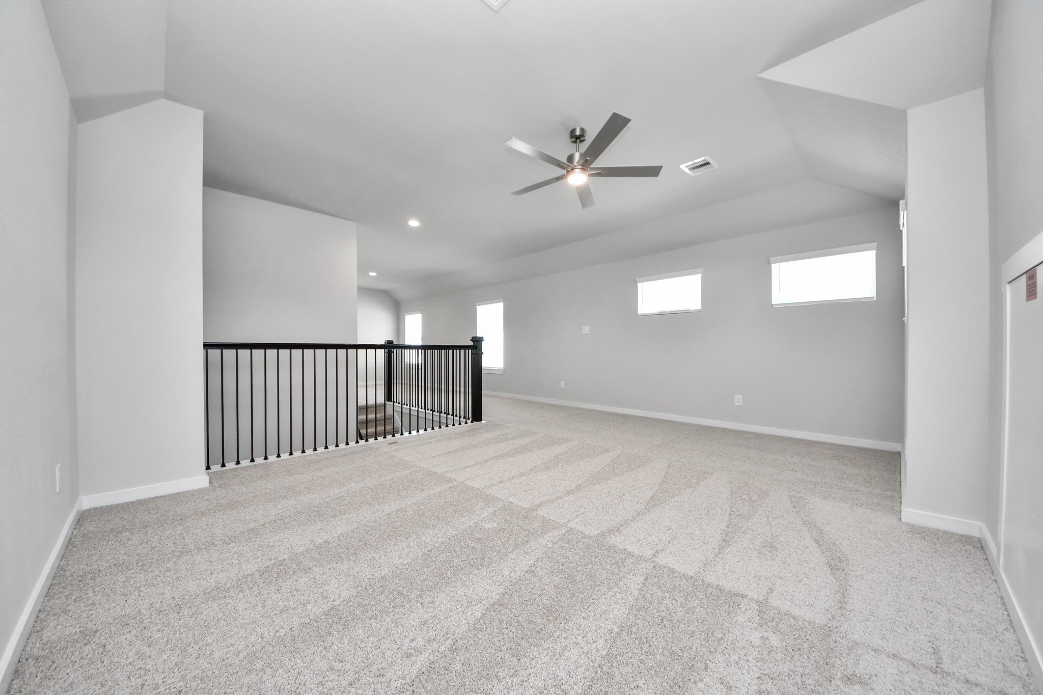3006 Burris Park Drive Spring, TX 77373 - Photo 31 of 45 Come upstairs and enjoy a day of leisure in this fabulous game room! This is the perfect hangout spot or adult game room! Features plush carpet, high ceilings, custom paint and windows for plenty of natural light.