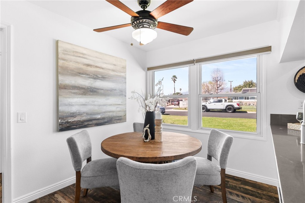 6661 Yucca Avenue Rialto, CA 92376 - Photo 13 of 44 a dining room with furniture and a floor to ceiling window