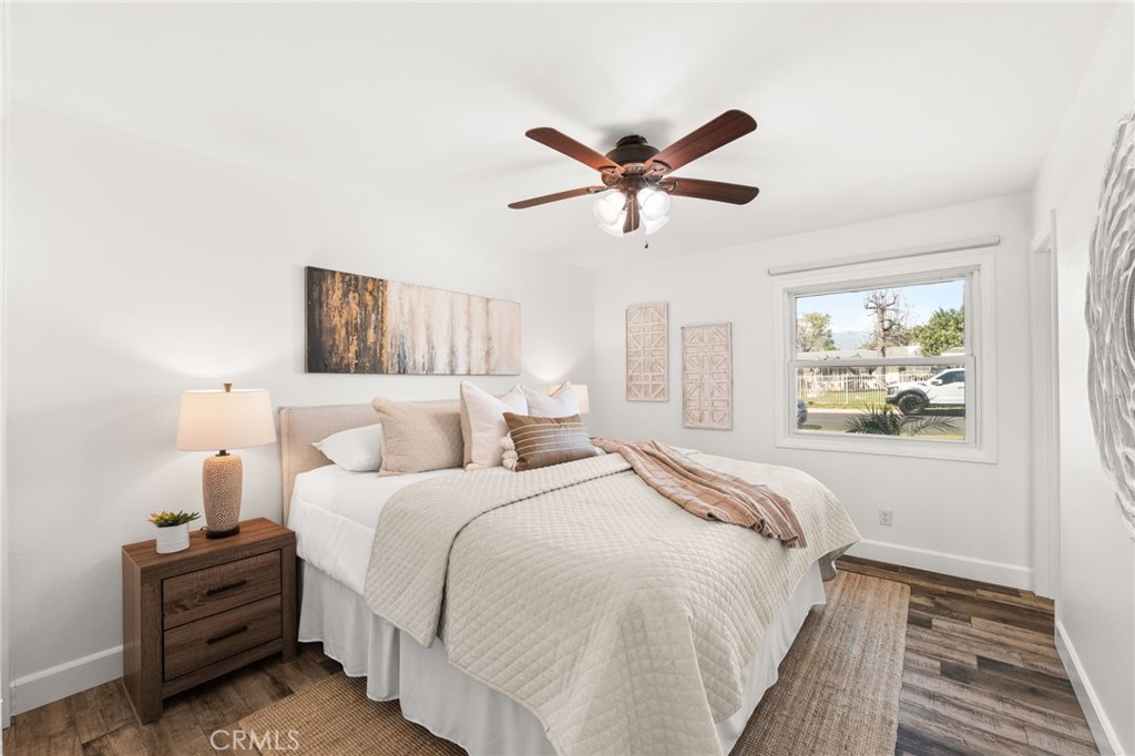 6661 Yucca Avenue Rialto, CA 92376 - Photo 19 of 44 a bedroom with a bed and a window