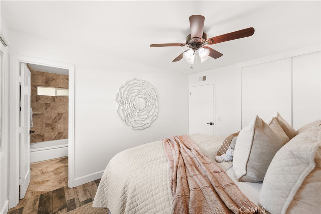 6661 Yucca Avenue Rialto, CA 92376 - Photo 20 of 44 a bedroom with a bed and a window