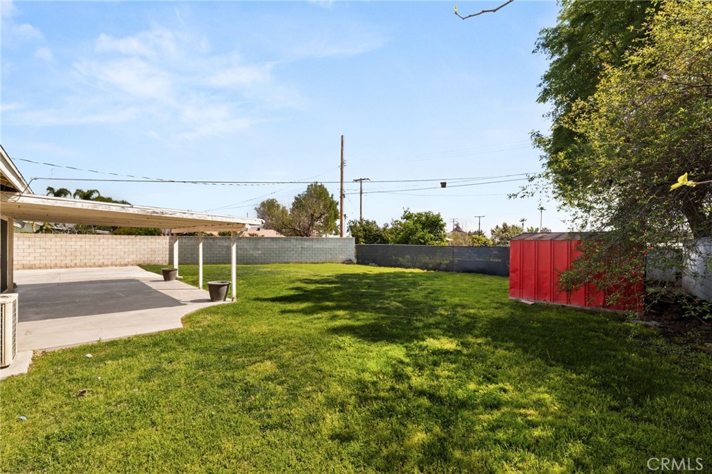 6661 Yucca Avenue Rialto, CA 92376 - Photo 33 of 44 a view of a house with a yard and sitting area