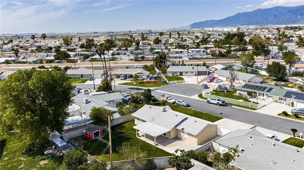 6661 Yucca Avenue Rialto, CA 92376 - Photo 42 of 44 an aerial view of a city with lots of residential buildings and ocean view in back