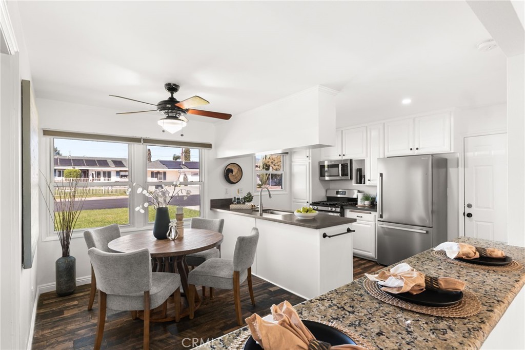 6661 Yucca Avenue Rialto, CA 92376 - Photo 5 of 44 a kitchen with a dining table and chairs