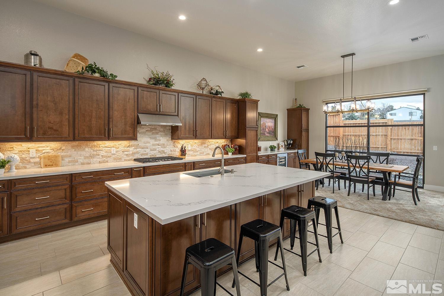 3020 Feathertop Drive Reno, NV 89521 - Photo 12 of 40 a kitchen with sink cabinets and wooden floor