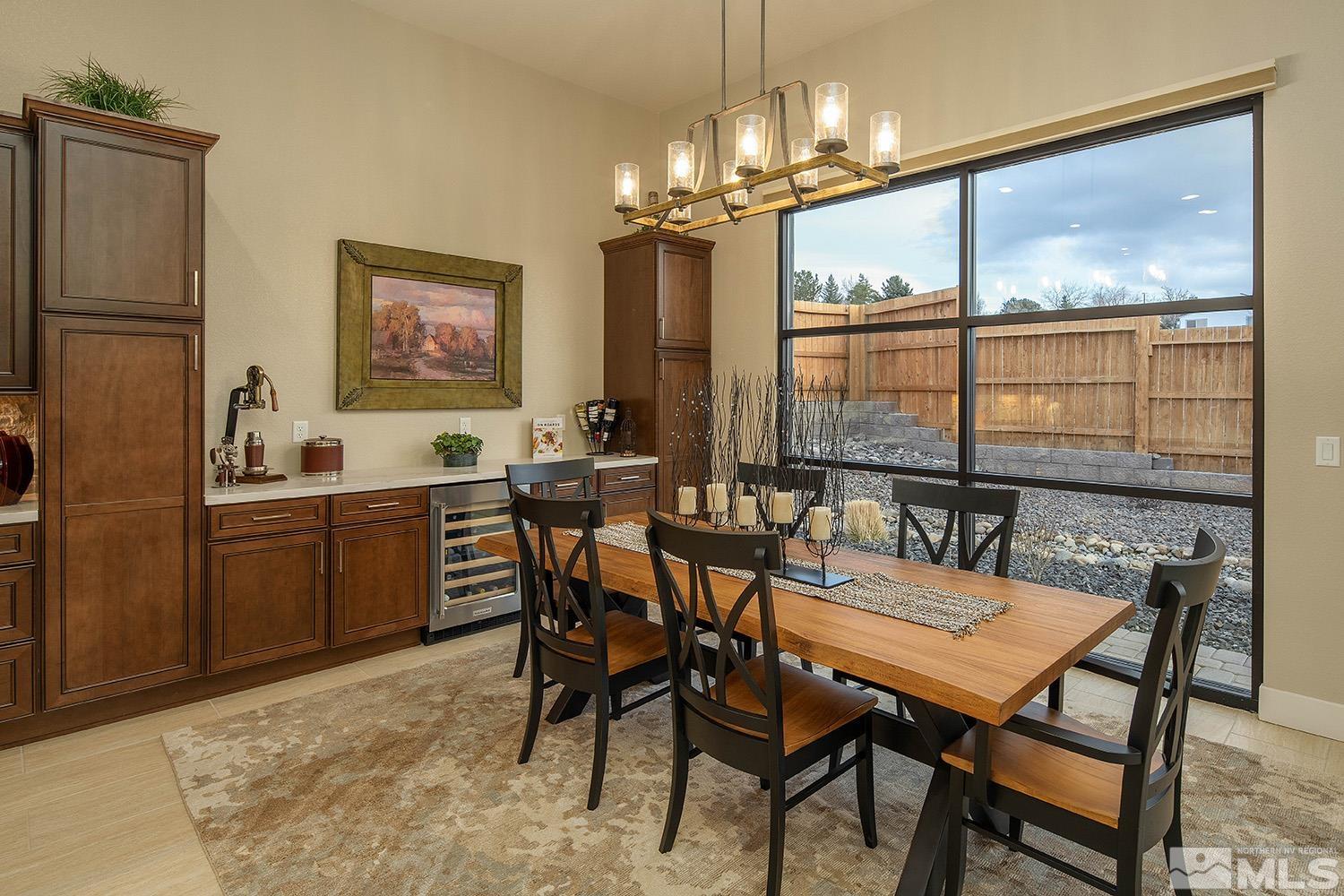 3020 Feathertop Drive Reno, NV 89521 - Photo 15 of 40 a dining room with furniture a chandelier and window