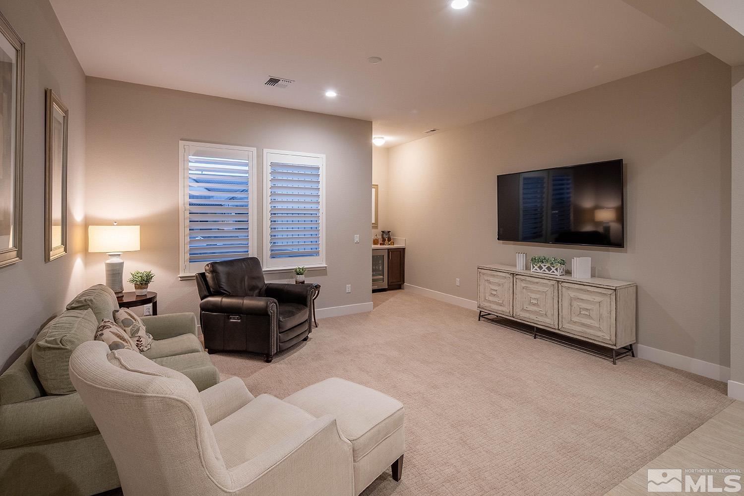 3020 Feathertop Drive Reno, NV 89521 - Photo 17 of 40 a living room with furniture and a flat screen tv