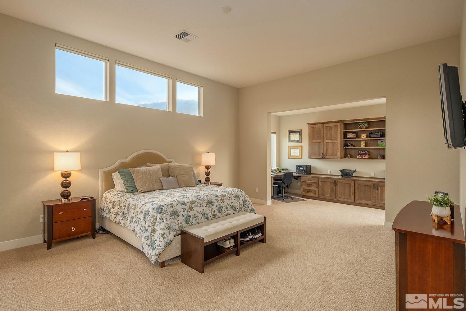 3020 Feathertop Drive Reno, NV 89521 - Photo 18 of 40 a spacious bedroom with a bed and wooden floor