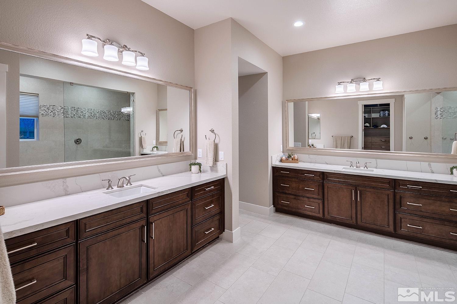 3020 Feathertop Drive Reno, NV 89521 - Photo 20 of 40 a spacious bathroom with a double vanity sink double and mirror