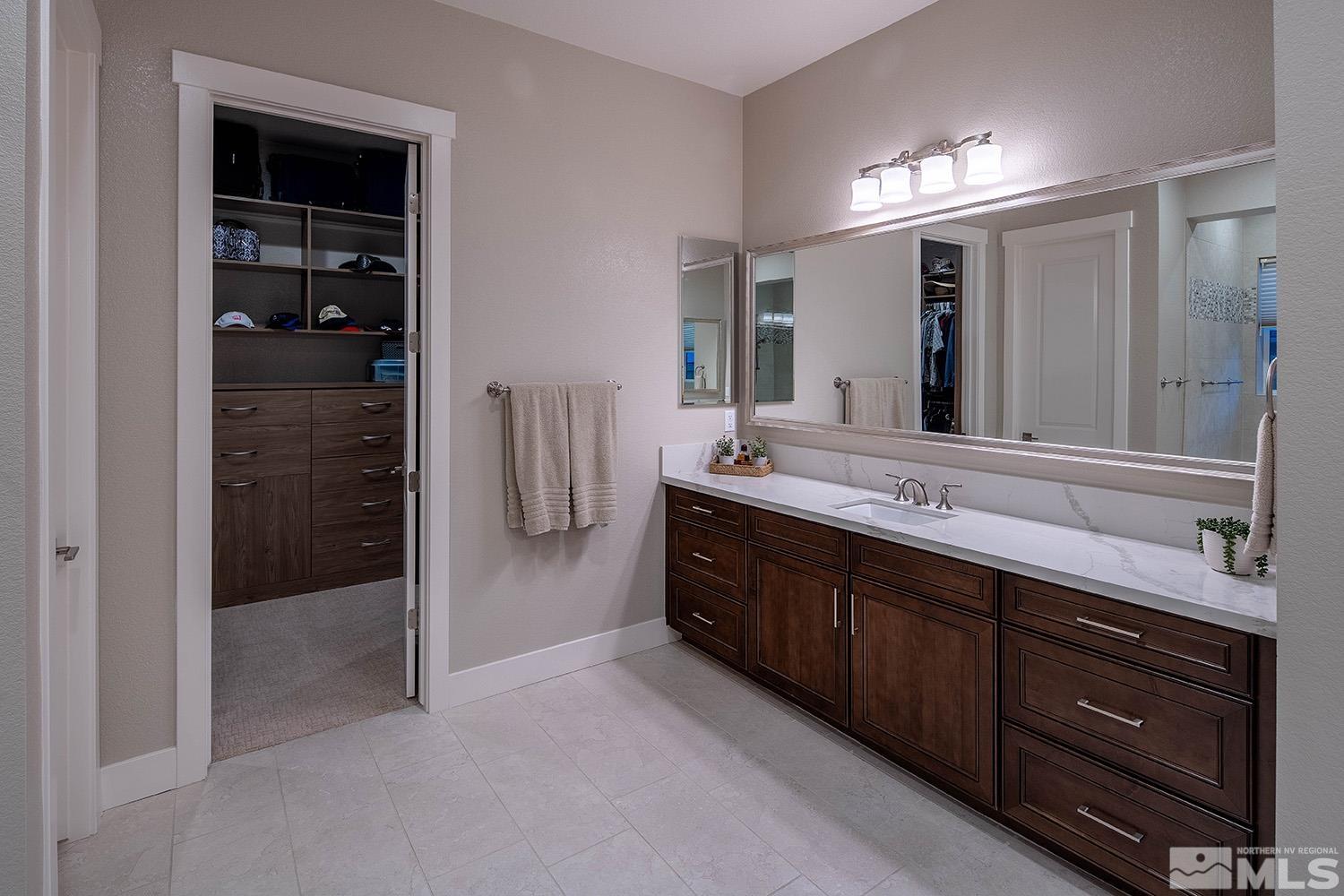 3020 Feathertop Drive Reno, NV 89521 - Photo 23 of 40 a spacious bathroom with a double vanity sink and a mirror