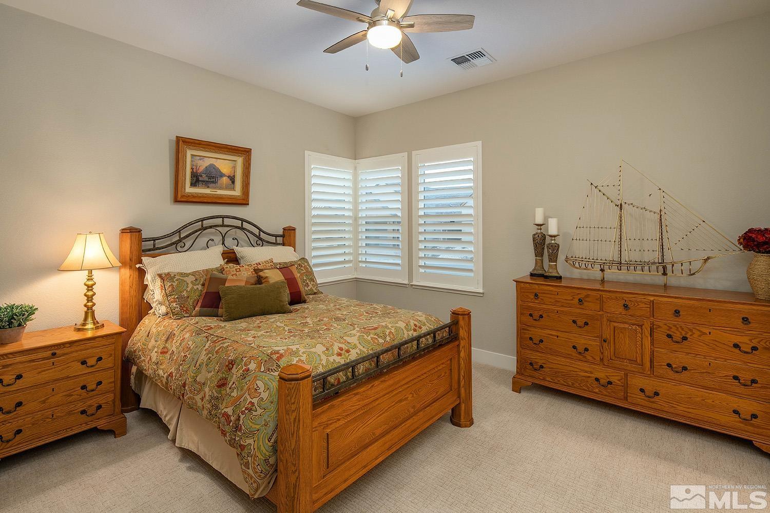 3020 Feathertop Drive Reno, NV 89521 - Photo 25 of 40 a bedroom with a bed and a dresser