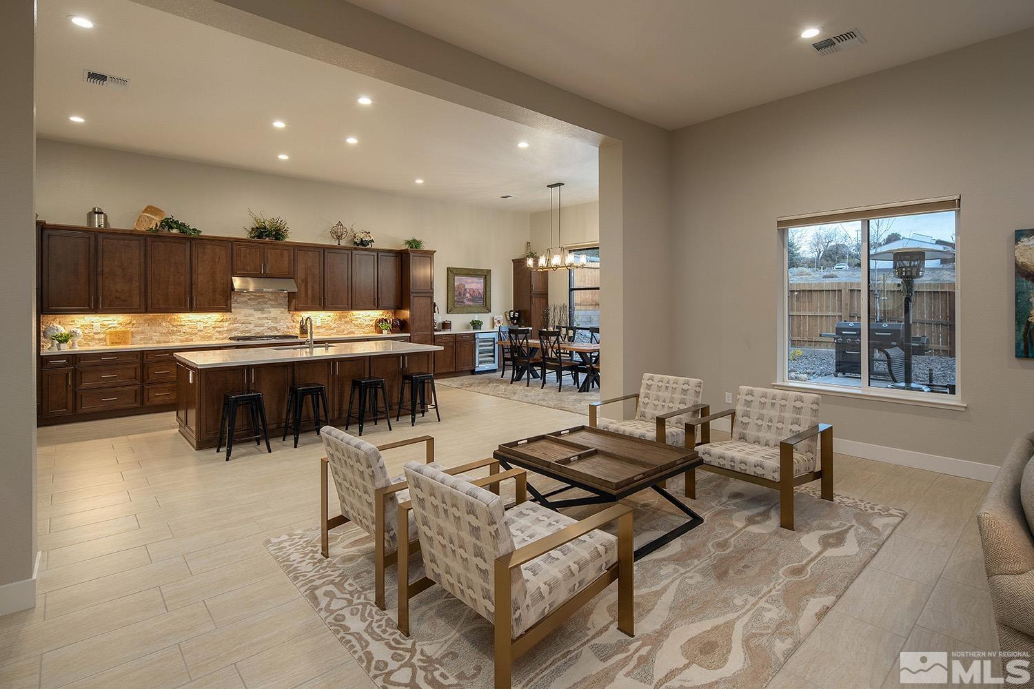 3020 Feathertop Drive Reno, NV 89521 - Photo 10 of 40 a living room with stainless steel appliances kitchen island granite countertop furniture and a kitchen view