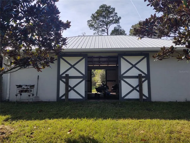 a view of a yard with an outdoor space