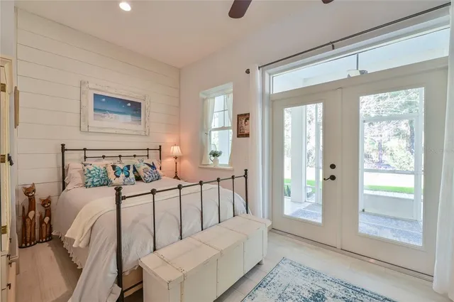 a living room with lots of furniture and a chandelier