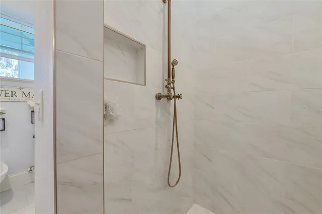 a very nice looking dining room with a large dining table and chairs