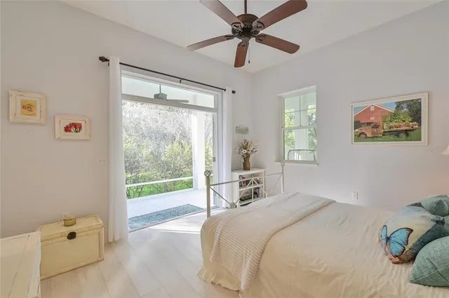 a kitchen with cabinets stainless steel appliances and a chandelier