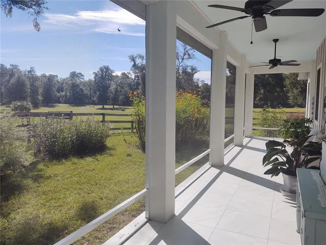 a view of house with swimming pool outdoor seating