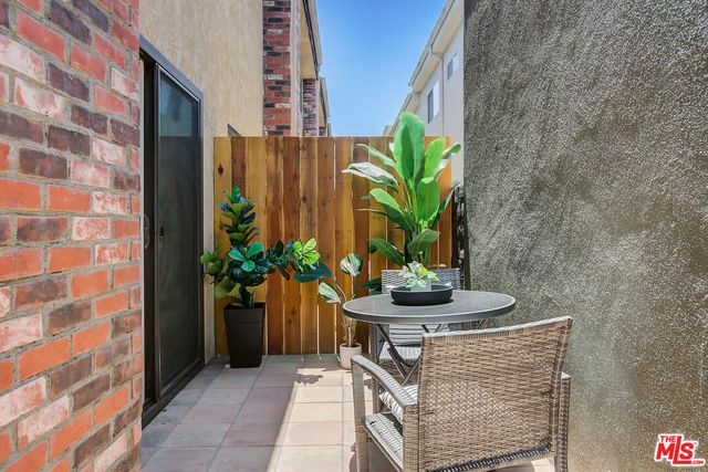 a potted plant sitting on a brick building