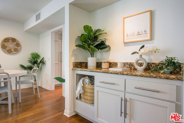 a view of living room with furniture and wooden floor
