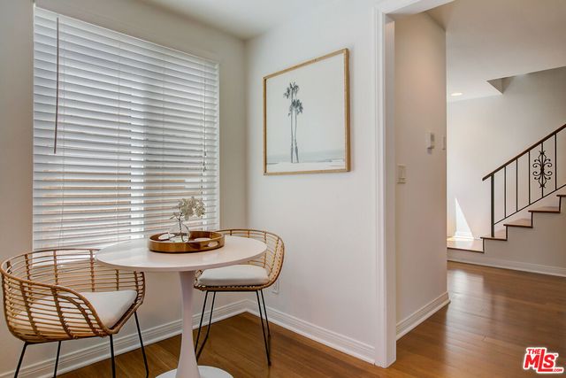 a view of a livingroom with furniture and wooden floor