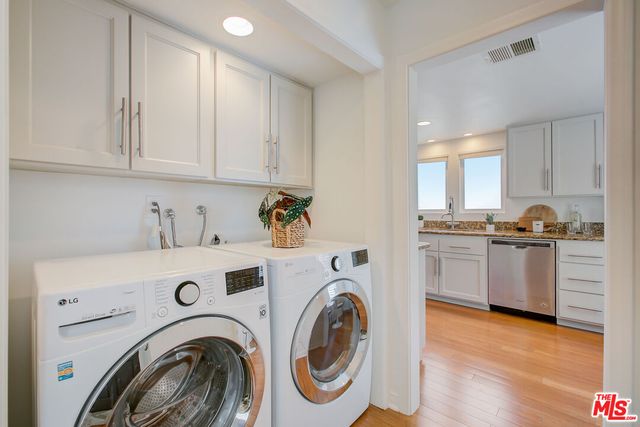 a view of a kitchen with washer and dryer