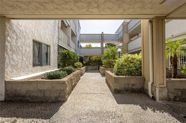 a living room with furniture gym equipment and a large window