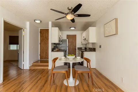 a view of kitchen with cabinets and wooden floor