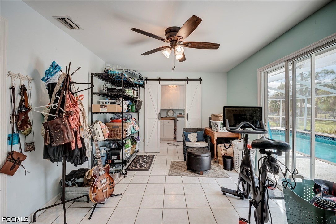 4110 East 23rd Street Alva, FL 33920 - Photo 12 of 38 a view of a livingroom with workspace and a window