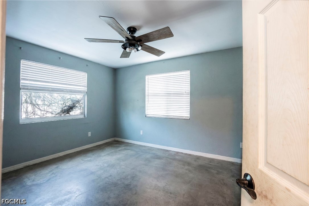 4110 East 23rd Street Alva, FL 33920 - Photo 16 of 38 an empty room with windows and fan