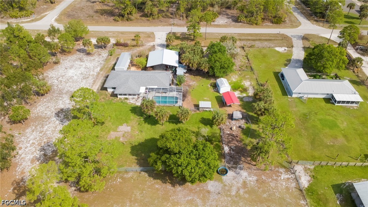 4110 East 23rd Street Alva, FL 33920 - Photo 28 of 38 a view of houses with swimming pool