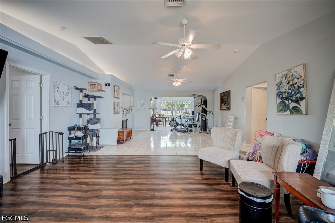 4110 East 23rd Street Alva, FL 33920 - Photo 3 of 38 a living room with furniture and wooden floor