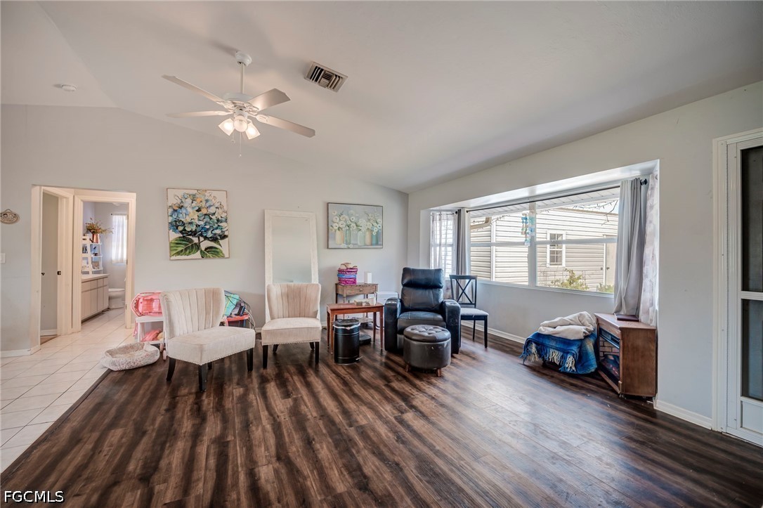 4110 East 23rd Street Alva, FL 33920 - Photo 4 of 38 a living room with furniture and wooden floor