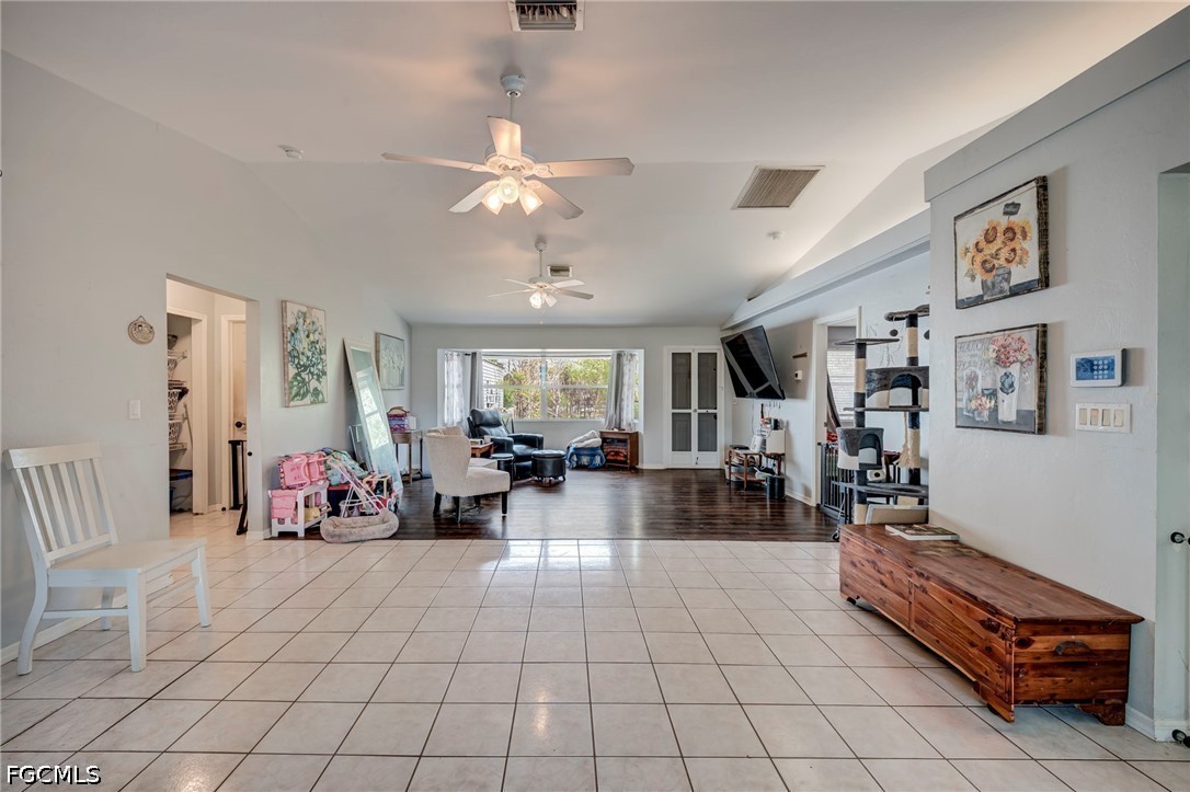 4110 East 23rd Street Alva, FL 33920 - Photo 5 of 38 a living room with furniture and a chandelier