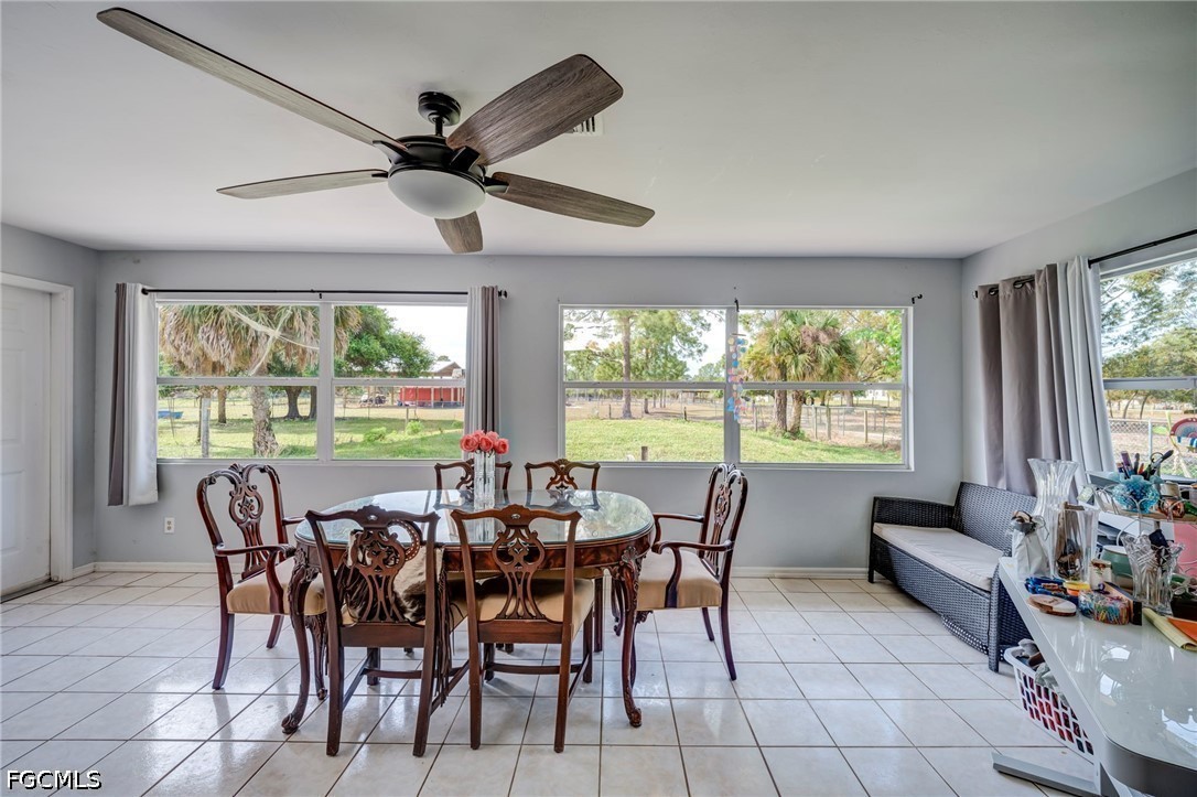 4110 East 23rd Street Alva, FL 33920 - Photo 8 of 38 a view of a dining room with furniture window and outside view