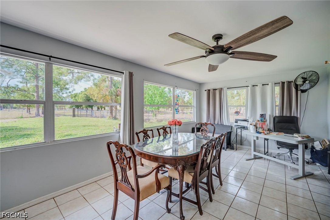 4110 East 23rd Street Alva, FL 33920 - Photo 9 of 38 a view of a dining room with furniture window and outside view
