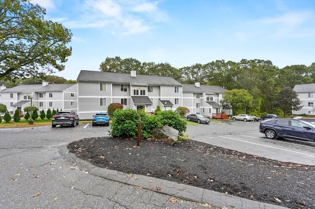 a view of a street with a parked cars