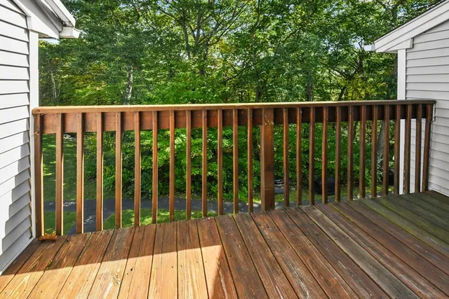 a view of balcony with wooden floor