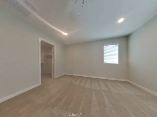 an empty room with a empty space and windows