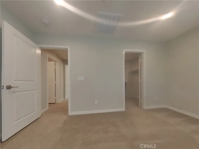 an empty room with closet area