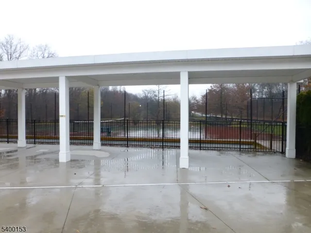 a view of a hall with wooden floor