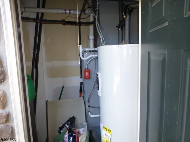a view of storage and utility room with a window